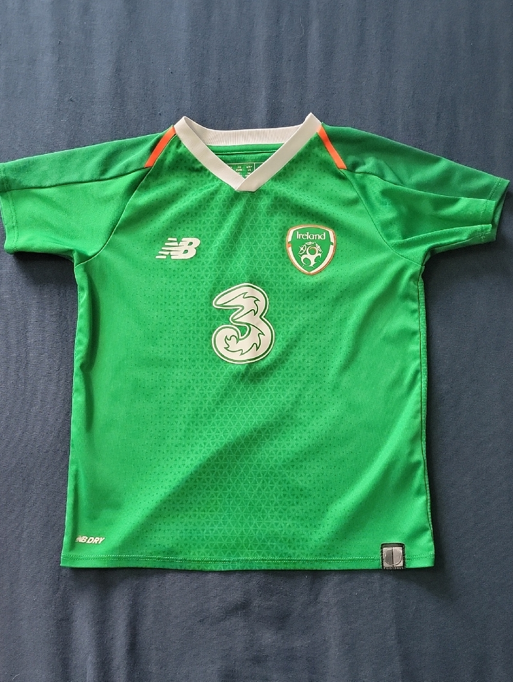 New Balance Bright Green Ireland Youth Soccer Jersey with White & Orange Trim